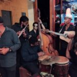 men playing music in a bar